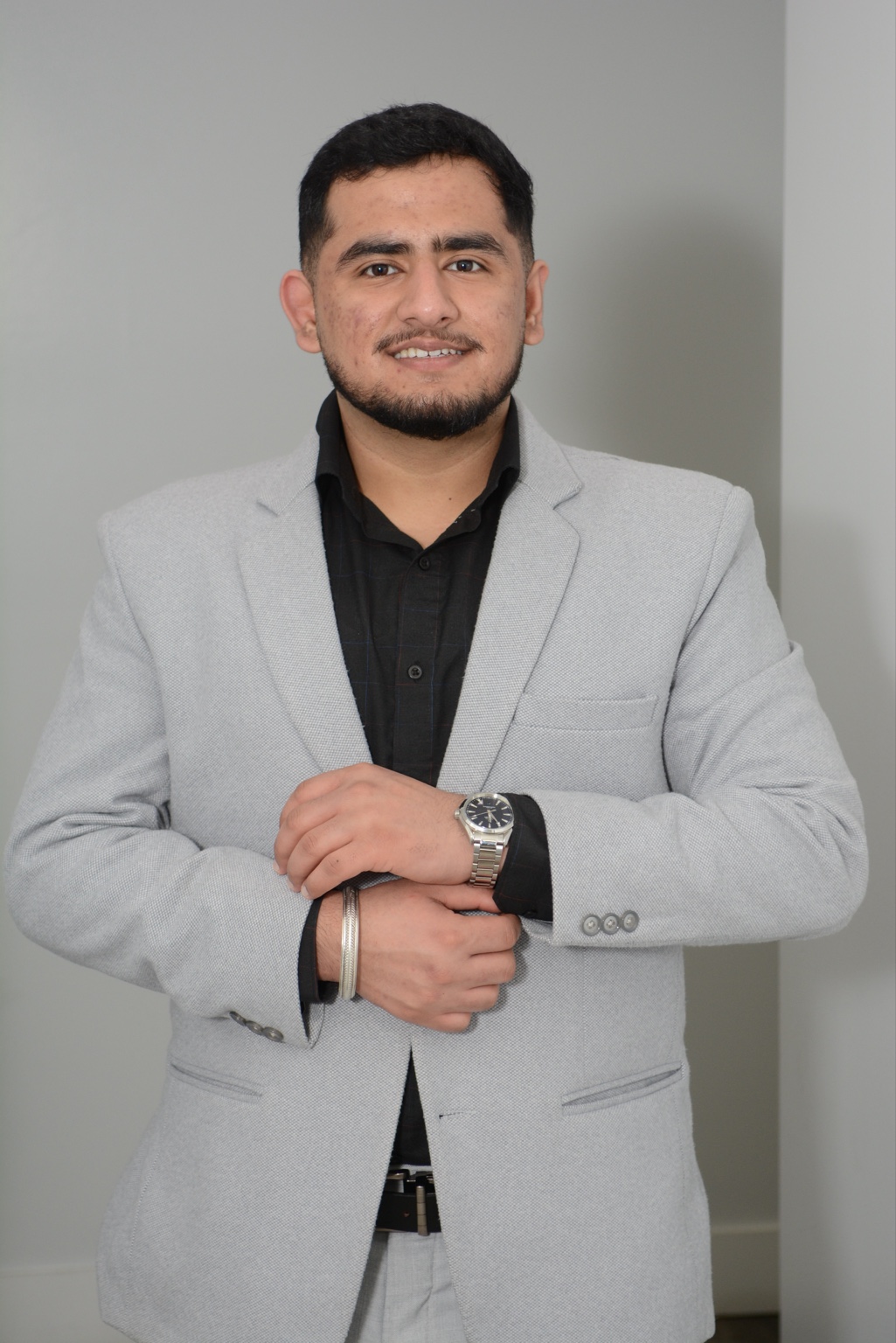 Swaraj Khurana wearing a grey suit
